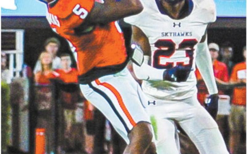 Georgia wide receiver RaRa Thomas (5) hauls in a 56-yard reception over UT-Martin’s Antonio Jackson (23). CHARLES JORDAN/Contributed