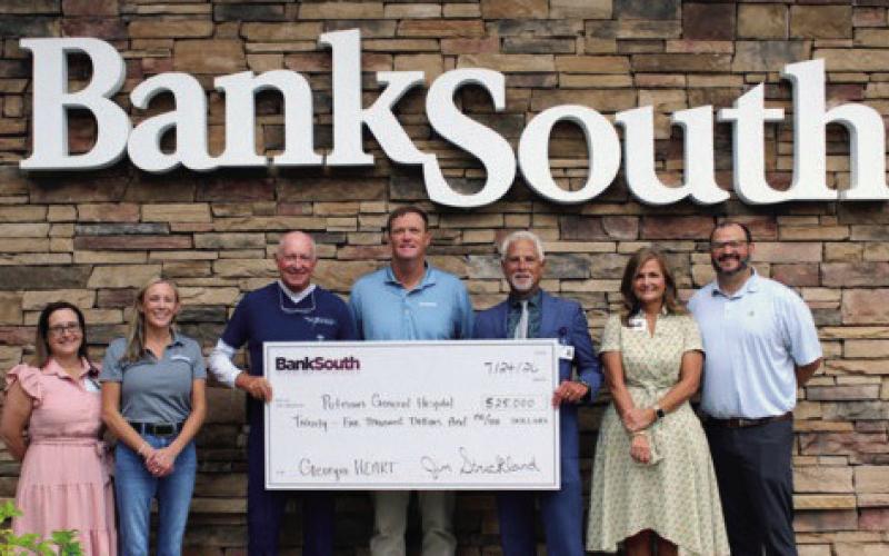 BankSouth representatives present a $25,000 ceremonial check to new Putnam General Hospital CEO Thomas Goss (third from right), in a brief ceremony held earlier this month. CONTRIBUTED
