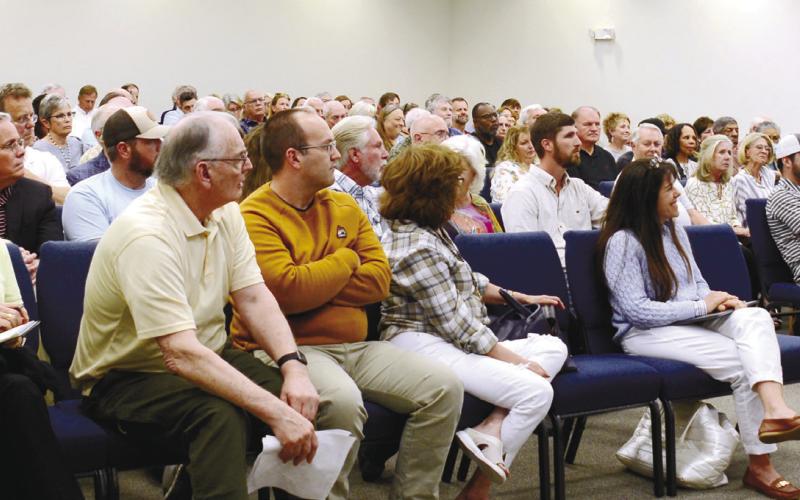 Putnam County Sheriff Howard Sills (at podium) was the first to speak in front of a crowded meeting about short-term rentals last Thursday at the county commission building last Thursday. IAN TOCHER/Staff