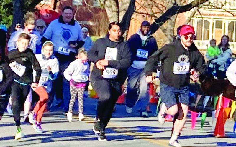Some smiles, some serious faces during the Fun Run start. LYNN HOBBS/Staff