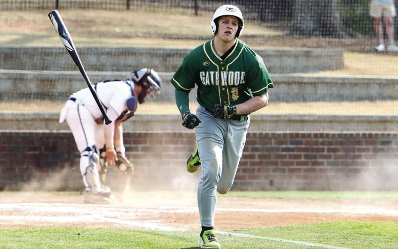 Gatewood's Trey Wiggins heads to first base on a walk after taking ball four from the GWA pitcher. LANCE MCCURLEY/Staff