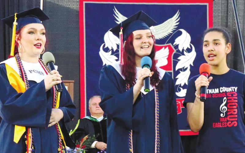 Literary Trio Delaney Chambers, Lylli Flanders, and Marielle Peguero Polanco perform during the ceremony.