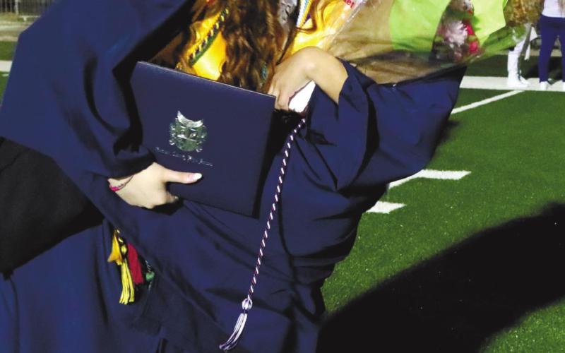 Madison Mclean and Mary Jewel Crosby celebrate graduation.