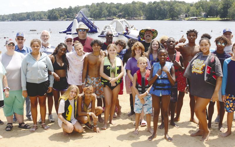 Last Saturday, members of Eatonton’s Rising Star Lodge #4 hosted staff and residents of the Masonic Home of Georgia at Oconee Springs Park. In between playing on the park’s giant inflatable water toys and going for boat rides on Lake Sinclair, the kids enjoyed barbequed hamburgers, hot dogs and ice-cold drinks provided and prepared for them by local Masons. IAN TOCHER/Staff