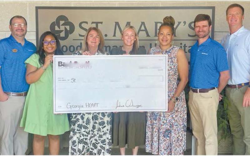 Employees of St. Mary's Good Samaritan Hospital in Greensboro accept a $100,000 contribution from BankSouth through the Georgia HEART Rural Hospital Tax Credit Program.
