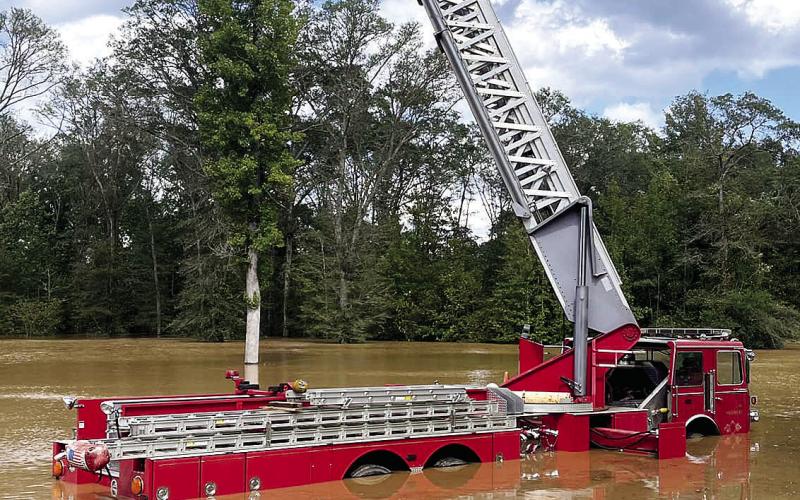 This decommissioned firetruck at Old Hudson Plantation holds a remote clay pigeon shooter at the top of its ladder. CONTRIBUTED