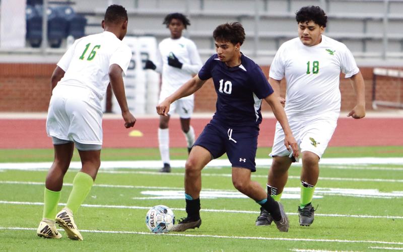 War Eagles’ leading scorer Emmanuel Meraz (10) weaves his way through several of Josey’s players before taking a shot on goal. LANCE MCCURLEY/Staff
