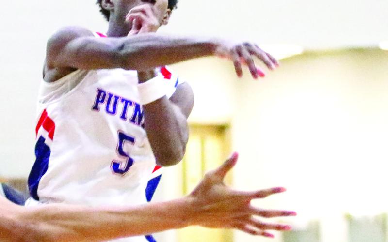 Putnam County rising senior Jaylin Harper (5) averaged nearly seven points per game last season. LANCE McCURLEY/Staff
