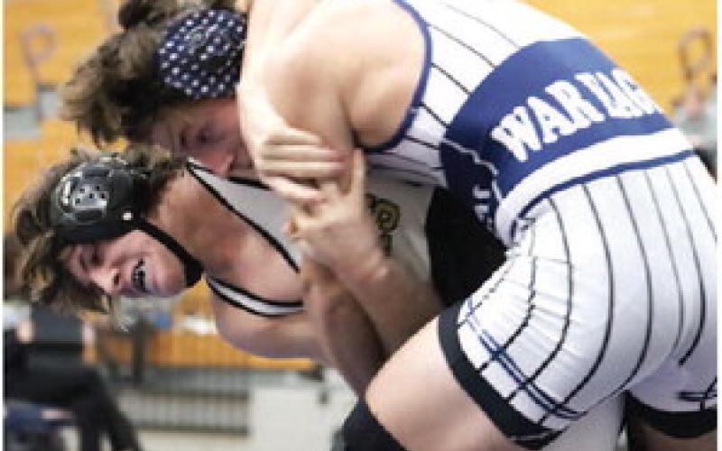 Mark Winslette secures a pin. ARELLA CASH/Staff
