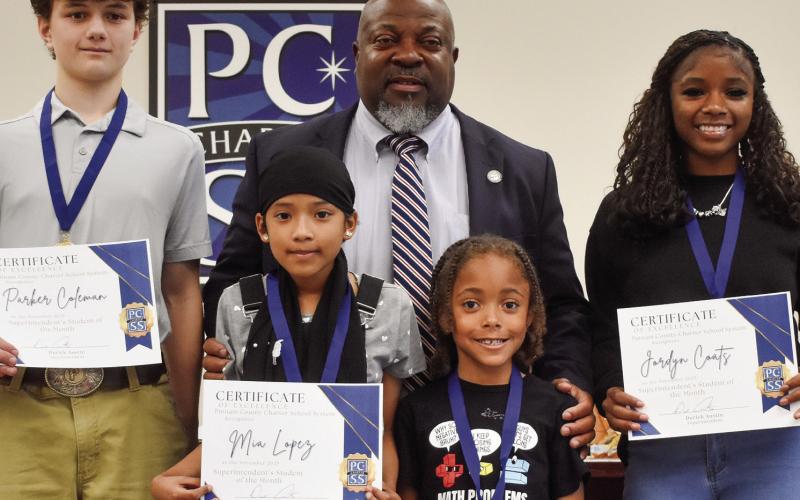 PCCSS Superintendent Derick Austin stands with November Students of the Month (l-r) Parker Coleman, Mia Lopez, Chance Farley, and Jordyn Coats. BAILEY BALLARD/Staff