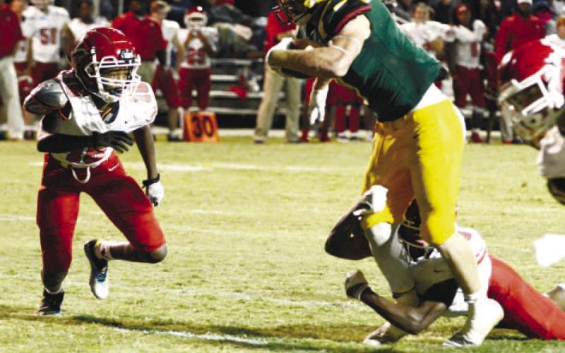Gatewood’s Evan Bennett begins his leap toward the end zone to score the Gators’ lone touchdown Sept. 23, in a 42-7 loss to the visiting Pacelli Vikings. IAN TOCHER/Staff
