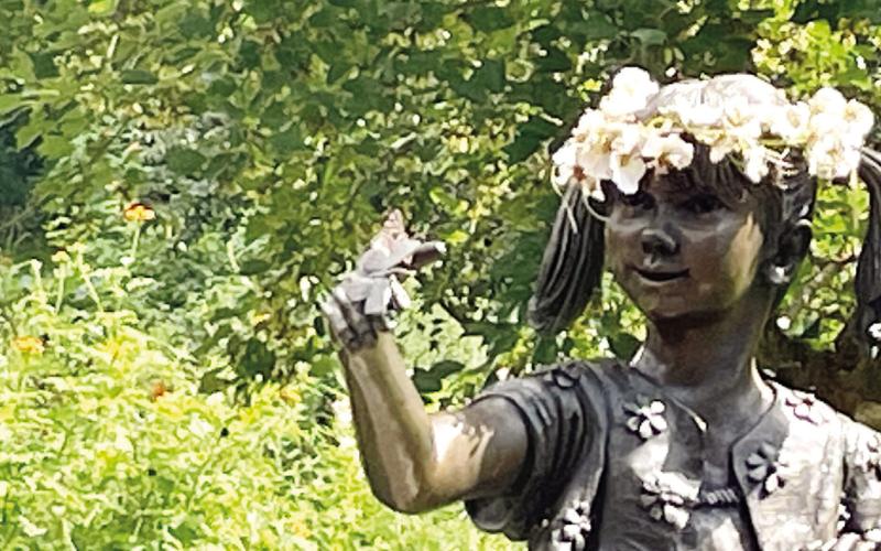 The hackberry emperor butterfly poses atop the sculpture’s butterfly, where it remained for photos. VIRGINIA LINCH/Contributed