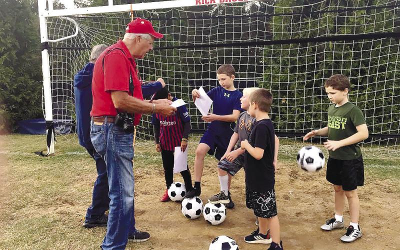 Lake Oconee Elks Soccer Shoot Chairman Bob Pluta delivers last-minute instructions to competitors at a previous Soccer Shoot event. CONTRIBUTED