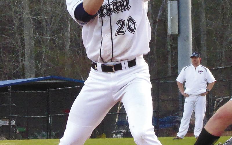 Putnam County senior Jacob Grimes (20) eyes down a Banks County pitcher. TREY NORRIS/Staff