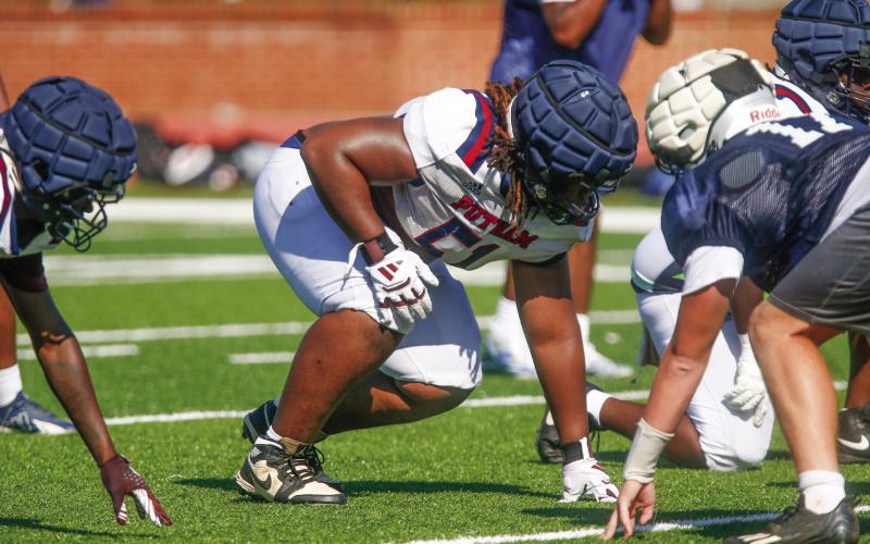 Putnam County defensive lineman Japeth Nelson gets set before a play during a padded camp in Eatonton last month. LANCE McCURLEY/Staff