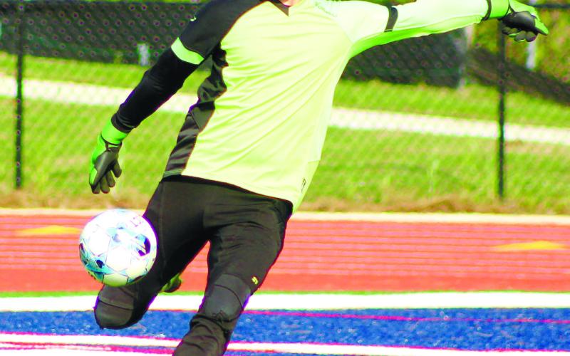 Putnam County senior goalkeeper Preston Wilson punts the ball downfield. ARELLA CASH/Staff