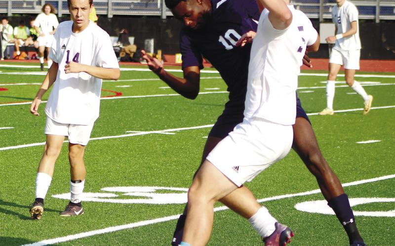 Jermaine Nelson (10) attempts to steal the ball away from a Union County striker. ARELLA CASH/Staff