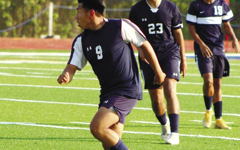 War Eagle Christopher Perez (9) moves the ball upfield. ARELLA CASH/Staff