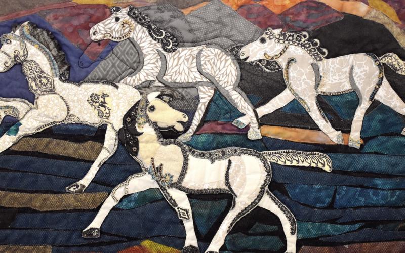 This quilt was made by Pat Gray and Lisa Albury as an interpretation of Steffen Thomas’ art. BAILEY MCCULLY/Staff