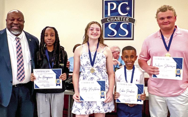 L-R: Superintendent Derick Austin named the March students of the month: Jai Hargrove, Abby Mashburn, Cobee Parham, and Jackson Stevenson. CONTRIBUTED