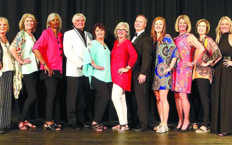 Following the fashion show, models, presenters and organizers gathered on stage from l-r: Ashley Culberson, Lisa Hanscom, Diana Arendt, Juleen DuBois, Josephine Giles, Rick Franks, Suzanne Ramsey, Melinda Spivey, Dr. Jay Spivey, Sarah Spivey, Charlotte Mosteller, Charlotte Engel, Tammy Beatty, Nellie Quiros and Cindy Falanga.