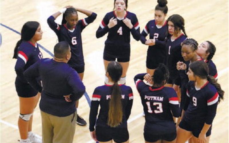 The Lady War Eagles talk things over with their coach.
