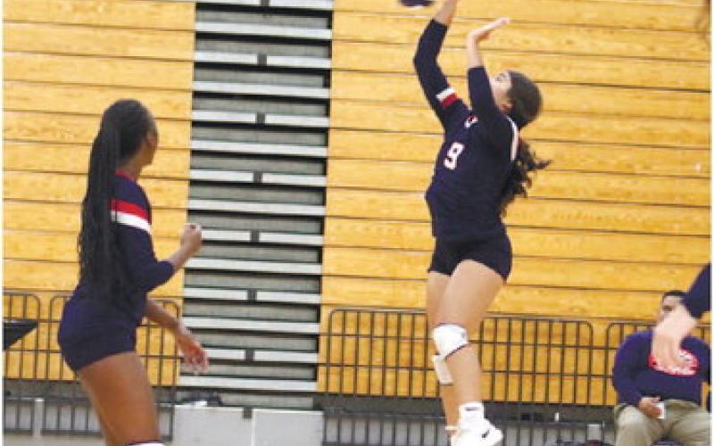 Lesyle Arriola returns the ball for a point against Piedmont Academy.