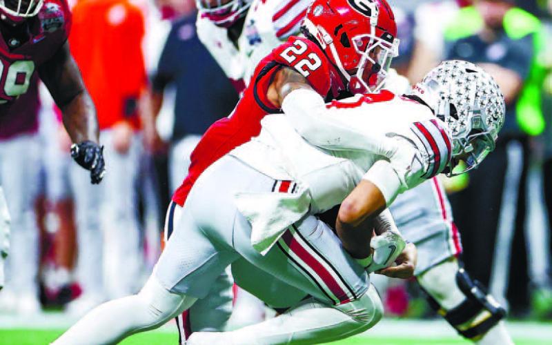 Defensive back Javon Bullard (22) sacks Ohio State quarterback C.J. Stroud (7). TONY WALSH/UGA Athletics