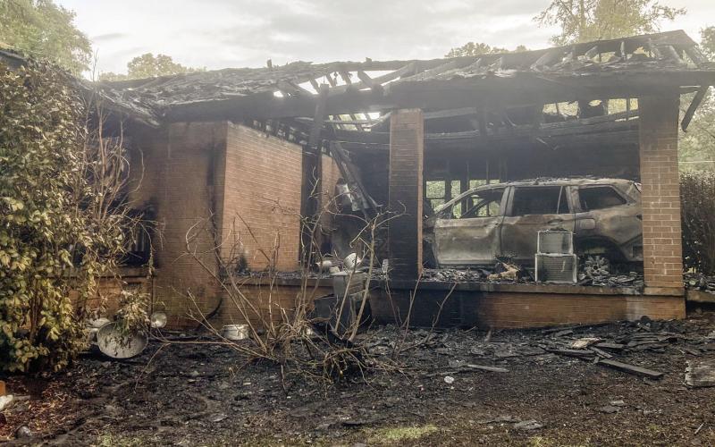 The back side of the house after the fire was extinguished shows the extent of the damage, including the loss of an SUV that was parked inside the carport. CHIEF WILLIAMSON/Contributed