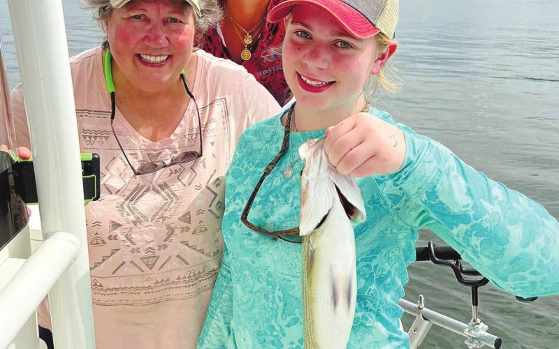 Annie, Nikki and Darcy with a big fish. CONTRIBUTED