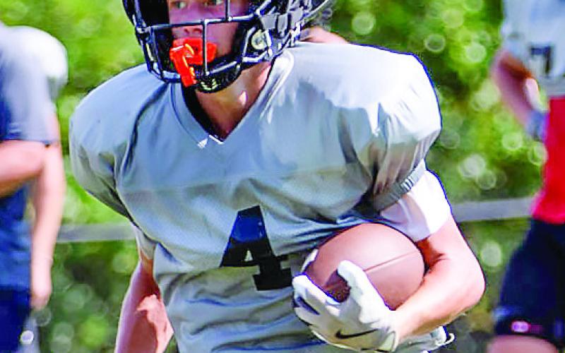 Senior Grant Smith (4) is versatile and will play a key role for Morgan County on both sides of the ball this year. LANCE McCURLEY/Staff
