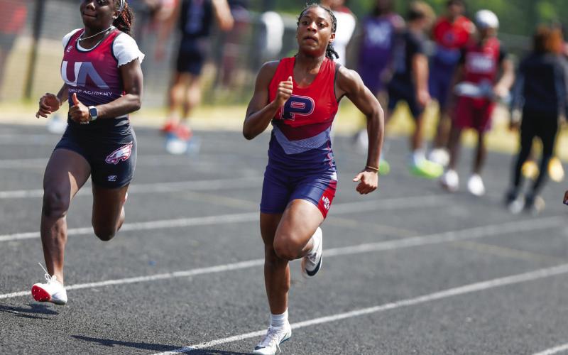 Putnam County freshman Aubree Butts competes in the 100-meter dash, where she finished second. LANCE McCURLEY/Staff