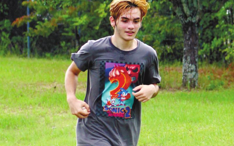 Senior Wyatt Stanley braves the summer heat to condition.