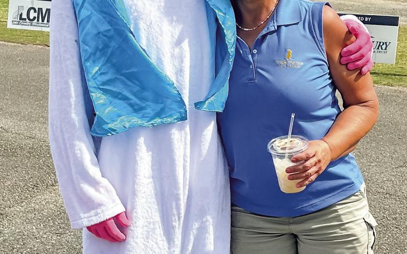 Project Putnam’s Diane Carter, who also works at the golf course, takes a moment for some quality time with the Easter Bunny.