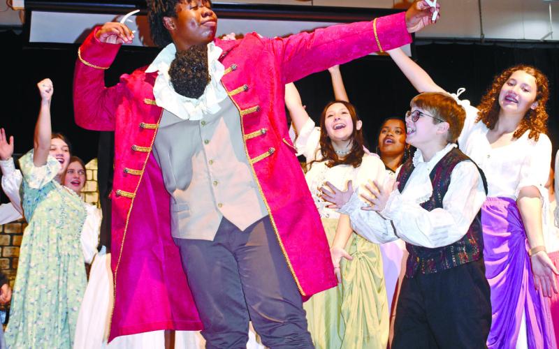 Lefou, played by Gabe Kelley (right), boosts Gaston’s ego after Gaston, played by Japheth Nelson, is rejected by Belle.