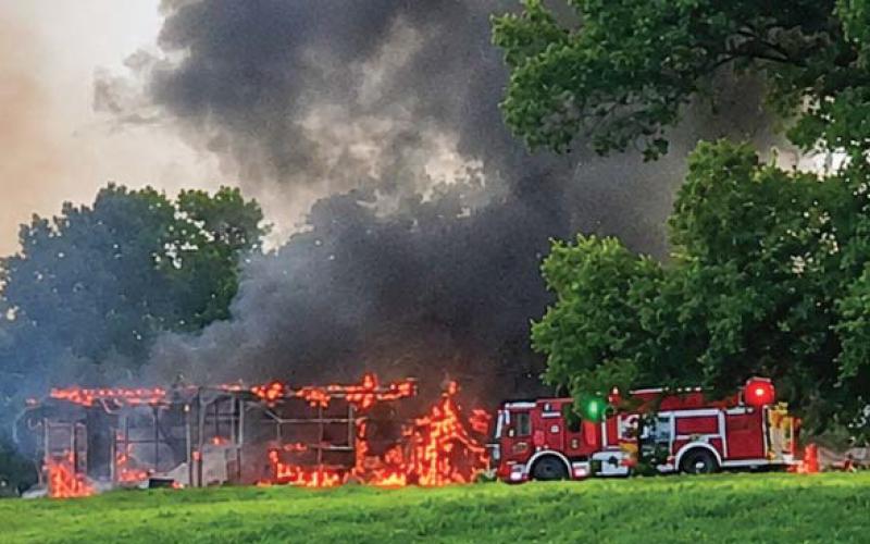 The barn and equipment inside it are totally destroyed by the blaze. CONTRIBUTED