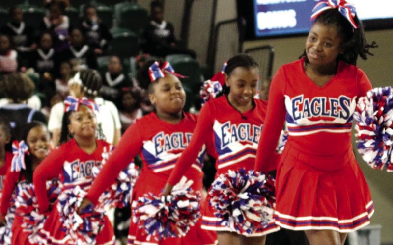 The Putnam County cheerleaders performed during halftime in the Centennial Center. TREY NORRIS/Staff