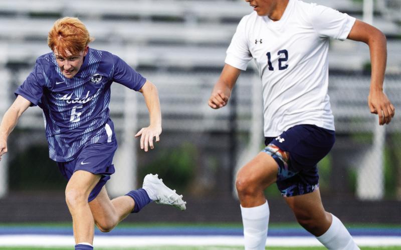 Model’s Brennan Dial (6) dribbles the ball away from Putnam County defender Dennis Sanchez (12). ZEKE PALERMO/Contributed