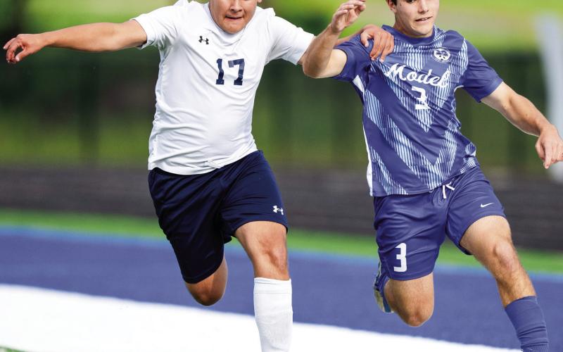 Putnam County’s Jose Garcia (17) and Model’s Luke Silver (3) battle for possession of the ball. ZEKE PALERMO/Contributed