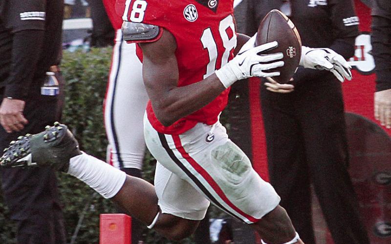 Georgia linebacker Chris Cole (18) recovered a Massachusetts fumble for a scoop and score. BRAD HARRISON/Staff