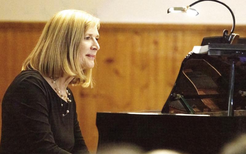 Dr Jana Williams played piano for the chorale throughout the night. LEIGH LOFGREN/Staff