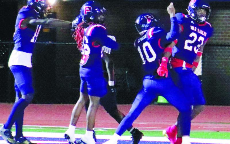 Jalon Kilgore (23) celebrates with teammates after his game-tying TD late in the fourth quarter against Laney on Friday night. ARELLA CASH/Staff