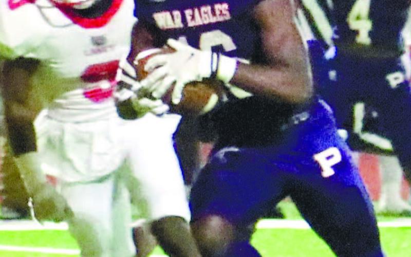 Brayon Farley (16) rumbles down the field, trying to evade a Laney defender. ARELLA CASH/Staff