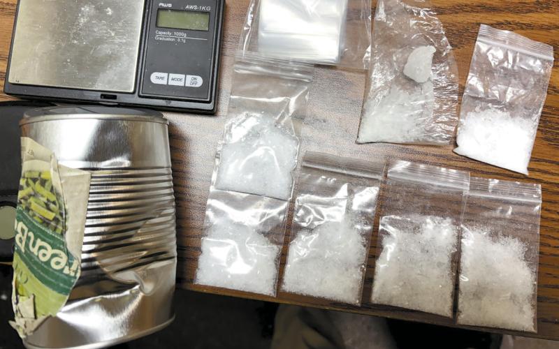 Packets containing 29 grams of crystal meth, scales, and a green bean can are among the items seized during a recent arrest in Putnam County. CONTRIBUTED/PCSO