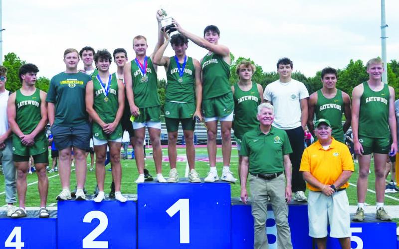 Gatewood’s head track and field coach Jeff Ratliff (yellow shirt) called his boys team’s rise from fifth overall to second statewide — thanks to an outstanding win in the 4X400-meter relay — “competition in its purest form.” CONTRIBUTED