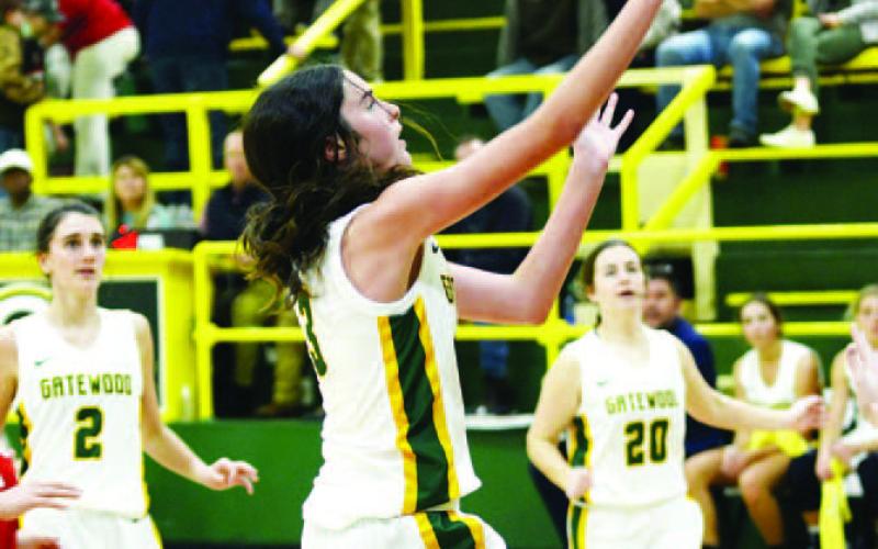 Gatewood freshman Riley Roberts (3) goes in for a layup as Sarah Mansfield (2) and Eliana Tkacik (20) look on. IAN TOCHER/Staff