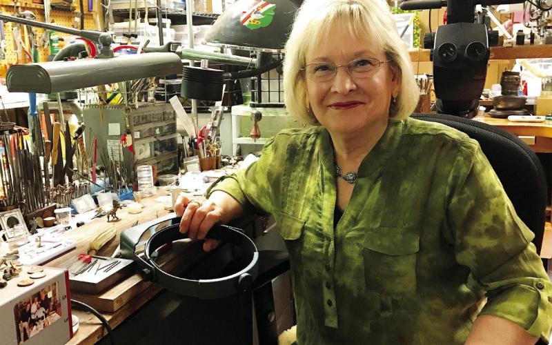 Georgia-based metal and jewelry artist Barbara Mann in her studio. CONTRIBUTED