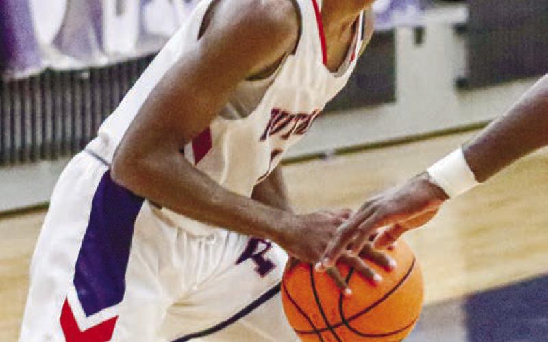 Eren Banks (1) was Putnam County’s leading scorer this past season, averaging over 20 points per game. LANCE McCURLEY/Staff