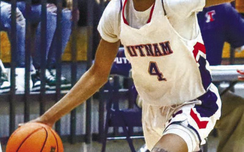 Keyni Crawford (4) was the team’s third-leading scorer and was named to the All-Region Second Team. LANCE McCURLEY/Staff
