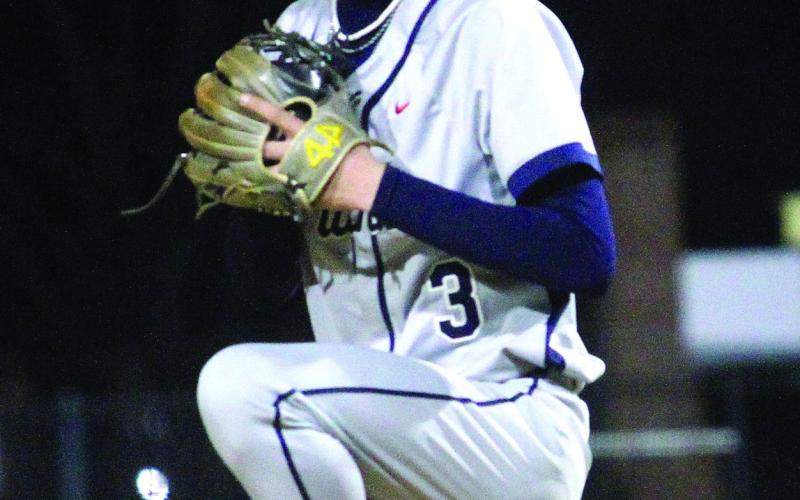 Putnam County’s Trace Watkins (3) in the wind-up, getting ready to deliver a pitch during a scrimmage against Jones County earlier this month. BRAD HARRISON/Staff
